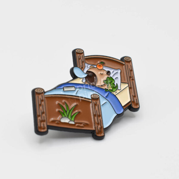 close up of sleeping capybara pin